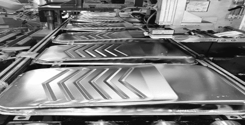 Paint roller trays made from stamped metal